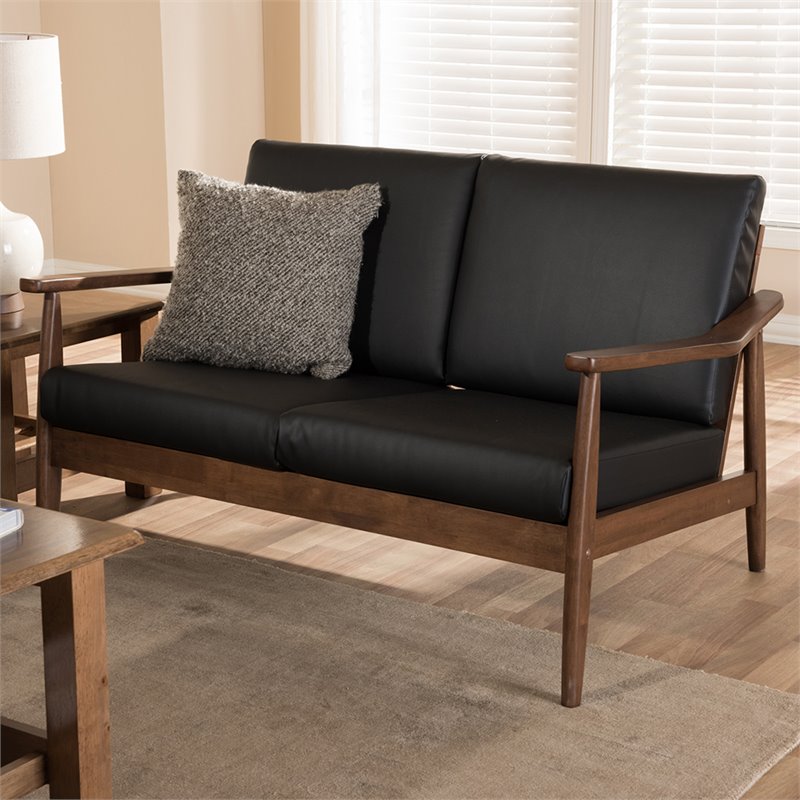 Bowery Hill Faux Leather Loveseat in Black and Walnut Brown