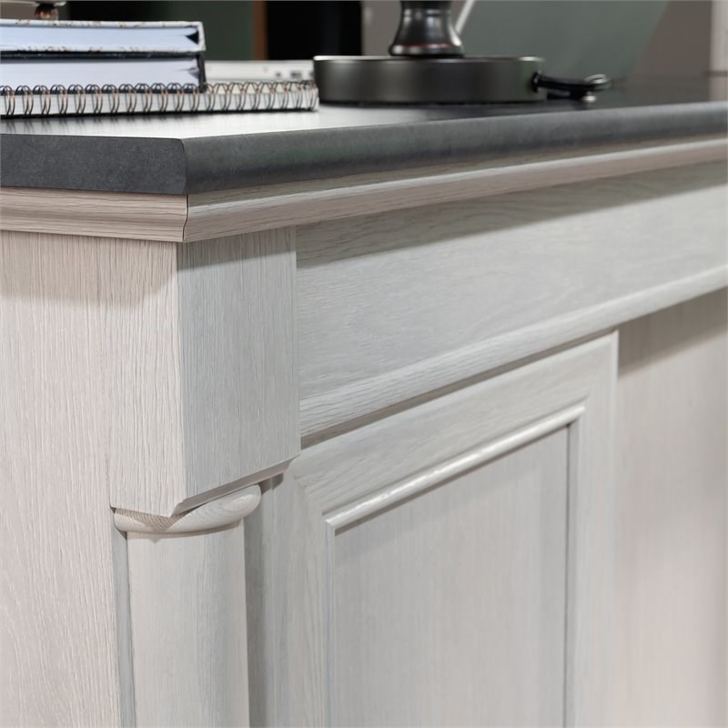 Bowery Hill Engineered Wood Executive Desk in Glacier Oak/Rosso Slate Accent