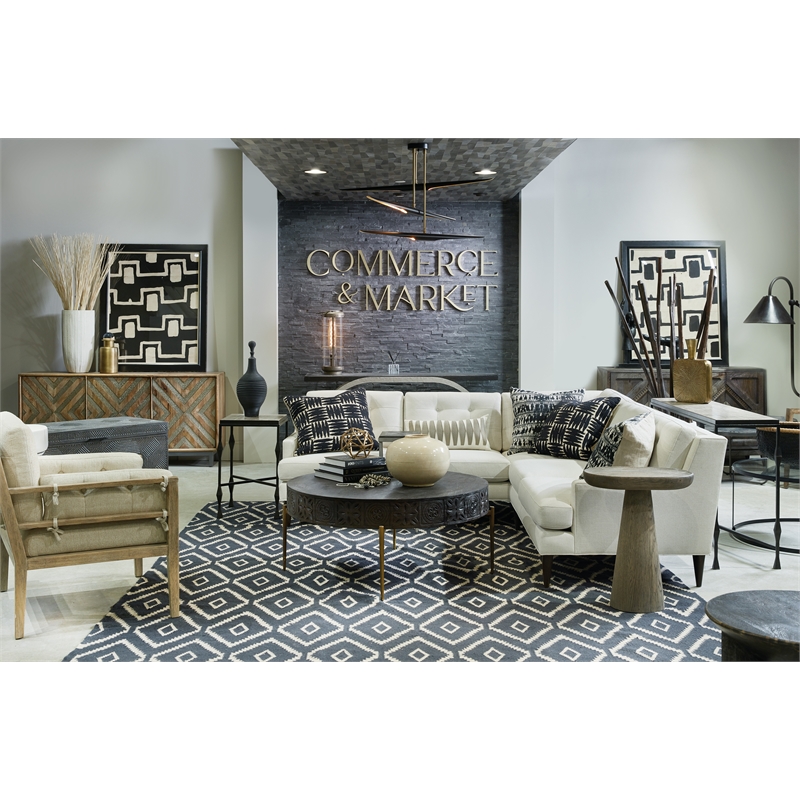 Bowery Hill Modern Carved Round Cocktail Table in Brown Wood