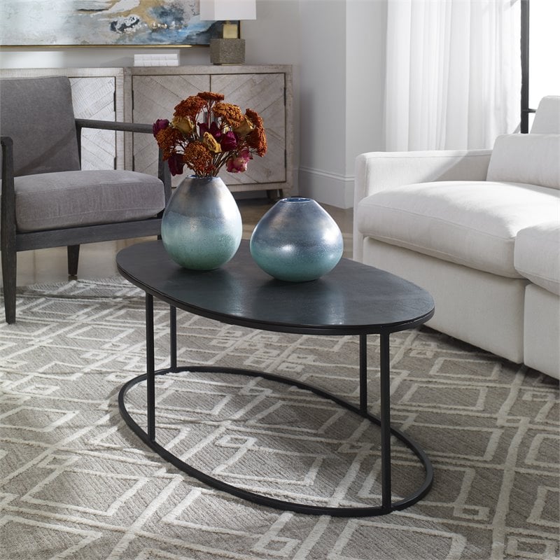 Bowery Hill Oval Iron Metal and Aluminum Coffee Table in Aged Black