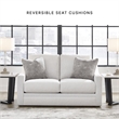 Bowery Hill Beige Loveseat with Reversible Cushions and Pillows