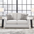 Bowery Hill Beige Loveseat with Reversible Cushions and Pillows