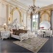 Bowery Hill Oval Wall Mirror with Scrollwork in Antique White