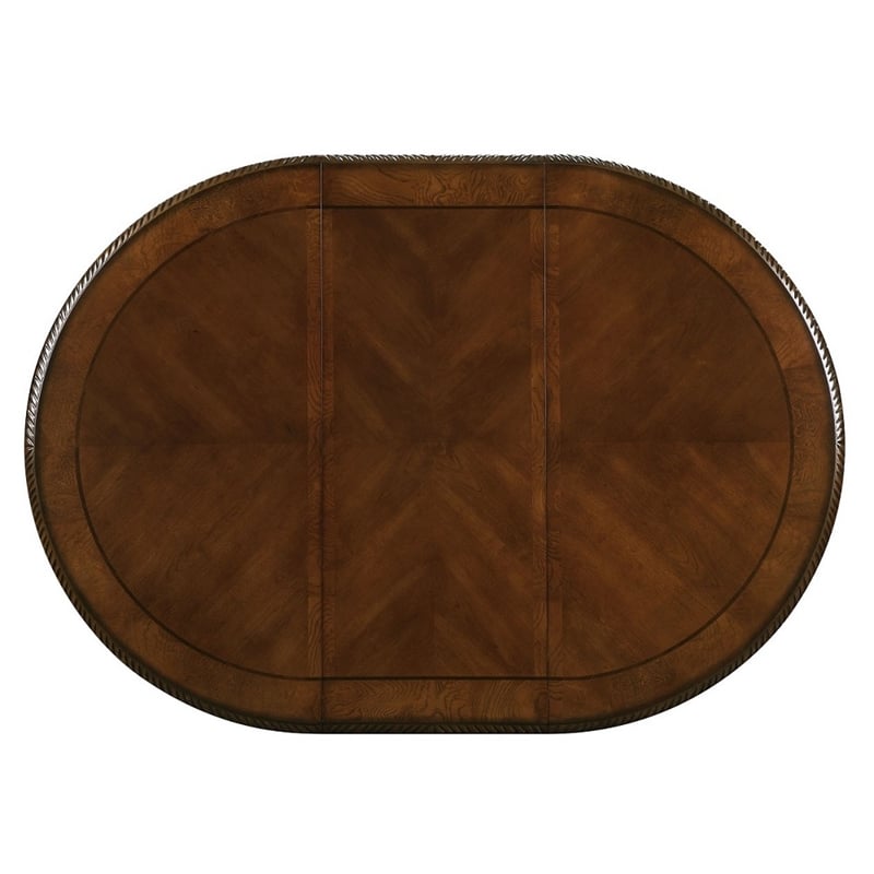Bowery Hill Round Single Pedestal Dining Table with Removable Leaf in Cherry