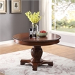 Bowery Hill Round Single Pedestal Dining Table with Removable Leaf in Cherry