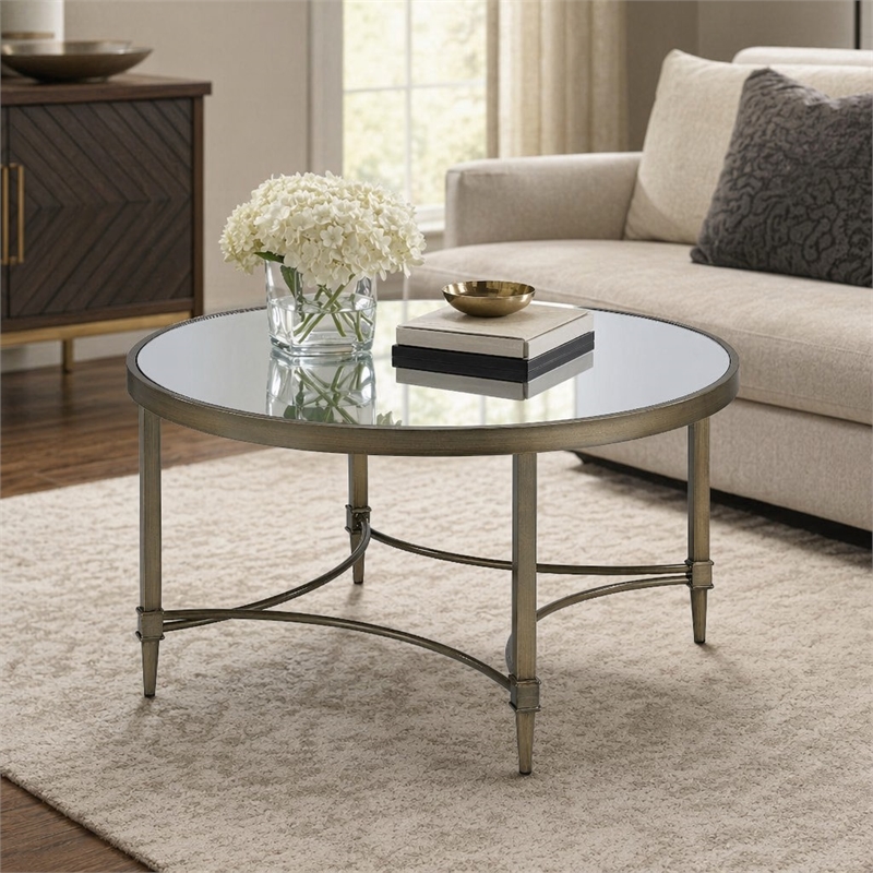 Bowery Hill Metal Coffee Table with Mirrored Top in Antique Brass