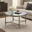 Bowery Hill Metal Coffee Table with Mirrored Top in Antique Brass