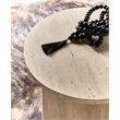 Bowery Hill Round Honed Travertine End Table in Cream and Beige