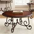 Pemberly Row Traditional Antique Metal Frame Round Wood Coffee Table in Cherry