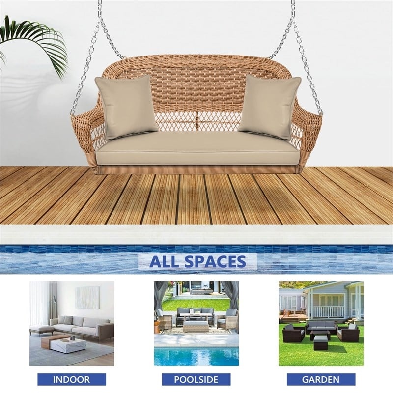Pemberly Row Resin Wicker Hanging Porch Swing with Cushion in Honey/Tan