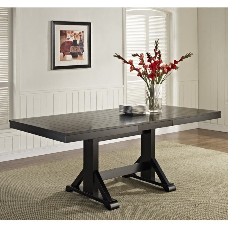 Pemberly Row Extendable Trestle Wood Dining Table in Antique Black
