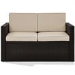 Pemberly Row Wicker Patio Loveseat In Brown with Sand Cushions