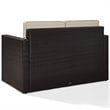 Pemberly Row Wicker Patio Loveseat In Brown with Sand Cushions