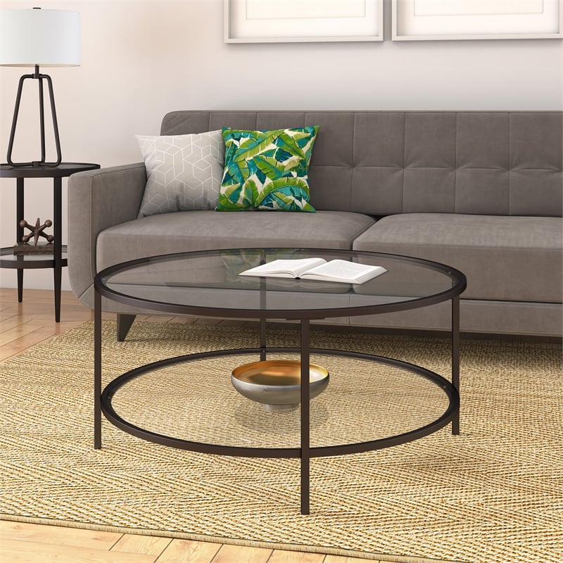Pemberly Row Two Shelf Round Metal Base Coffee Table in Black with Glass Top