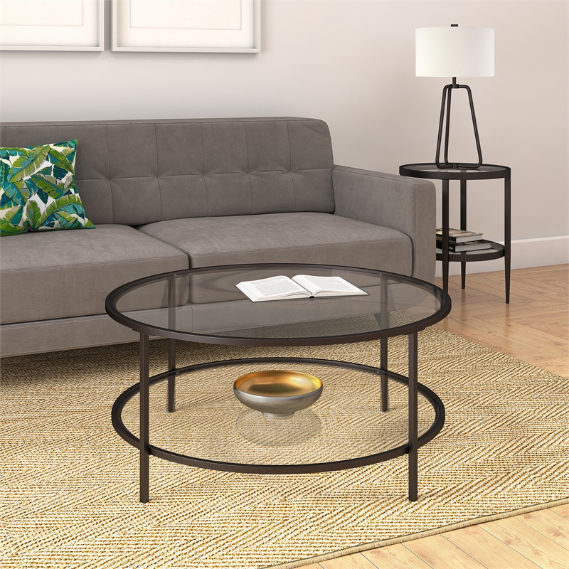 Pemberly Row Two Shelf Round Metal Base Coffee Table in Black with Glass Top