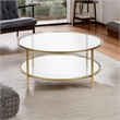 Pemberly Row Round Metal Base Coffee Table in Brass with Glass Top