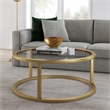 Pemberly Row Metal Round Pedastal Base Coffee Table in Gold and Brass Finish