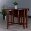 Pemberly Row Round Double Drop Leaf Solid Wood Dining Table in Antique Walnut