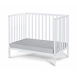 Pemberly Row Contemporary Wood Mini Crib with Mattress Pad in White