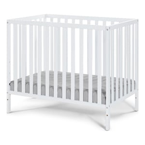 Pemberly Row Contemporary Wood Mini Crib with Mattress Pad in White