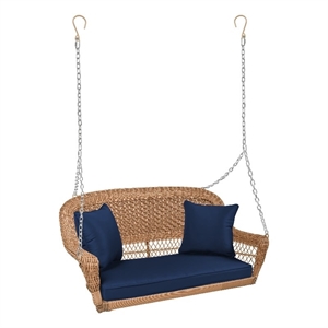 Pemberly Row Honey Resin Wicker Hanging Porch Swing with Cushion in Blue