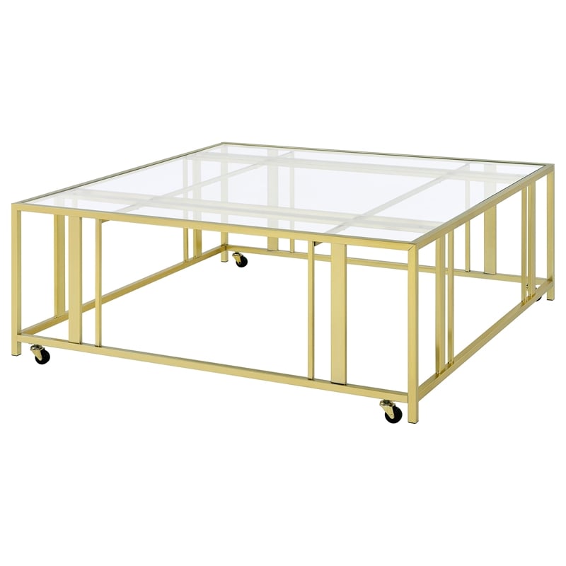 Pemberly Row Square Glass Top Coffee Table with Casters in Gold