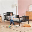 Pemberly Row Solid Rubber and Poplar Wood Toddler Bed with Guardrails in Black