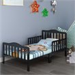 Pemberly Row Solid Rubber and Poplar Wood Toddler Bed with Guardrails in Black