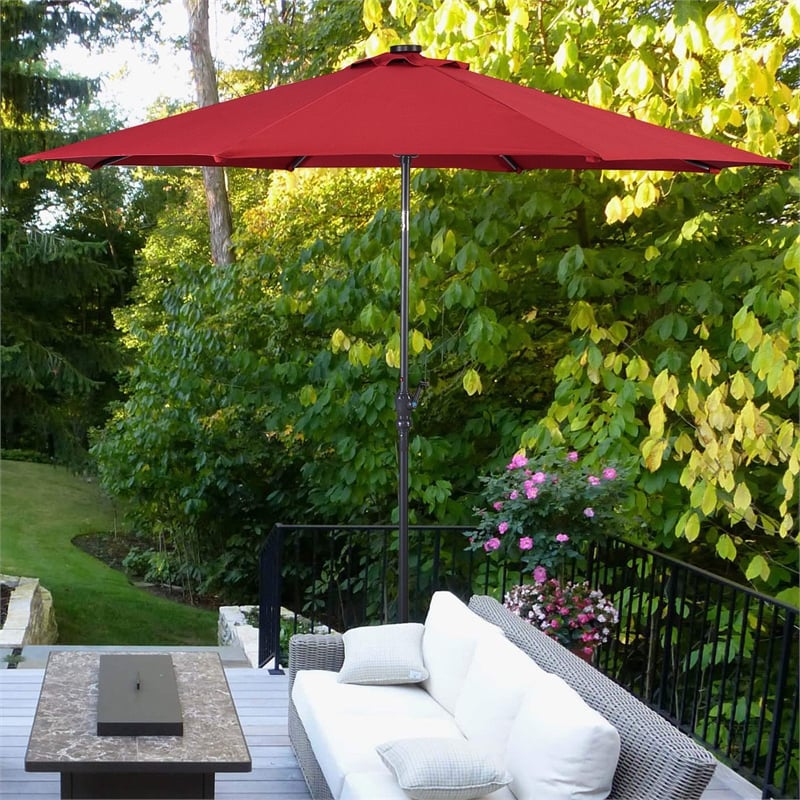 Pemberly Row 10ft Patio Solar Umbrella LED Patio Market Steel Tilt in Red