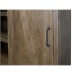Pemberly Row 8-Shelf Wood Bookcase with Sliding Door in Brown