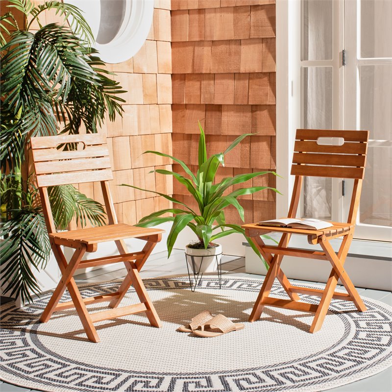 Pemberly Row Eucalyptus Wood Outdoor Folding Chair in Natural (Set of 2)