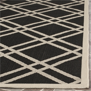 Pemberly Row Polypropylene Black Indoor Outdoor Rug - 4' x 5'7&quot