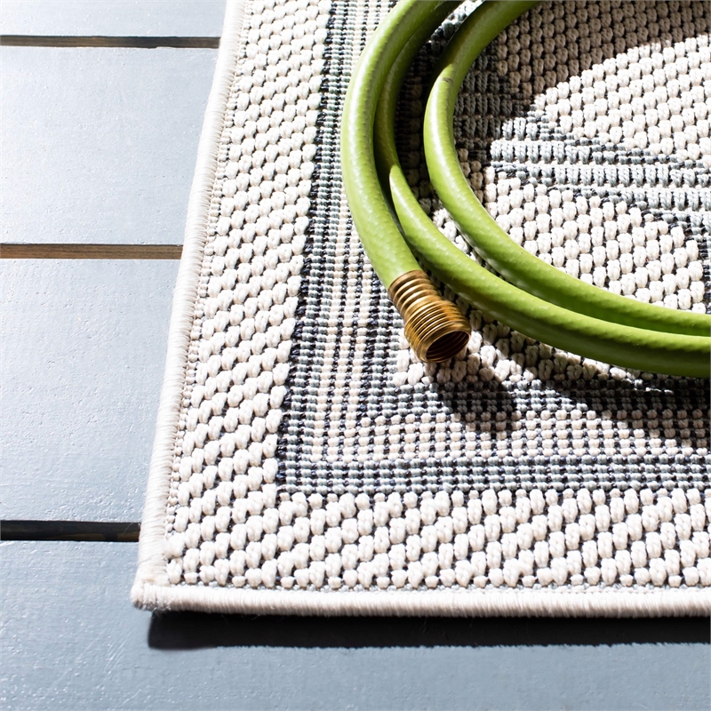 Pemberly Row Polypropylene 8' x 10' Rug in Ivory and Light Blue