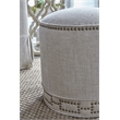 Pemberly Row Round Fabric Ottoman With Nail Head Design in Beige