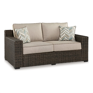 Pemberly Row 71&quot Outdoor Loveseat with 2 Throw Pillows in Brown Wicker/Beige