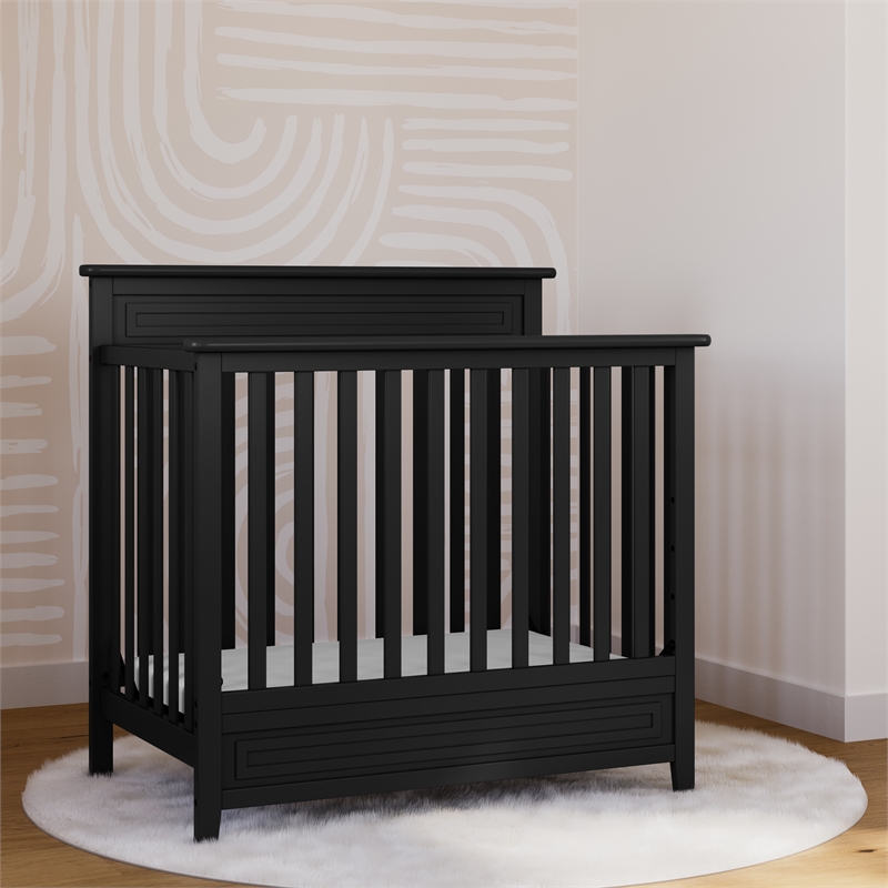 Pemberly Row 4-in-1 Engineered Wood Convertible Mini Crib in Black