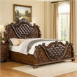 Pemberly Row Queen Bed with Carved Details and Tufted Faux Leather in Brown