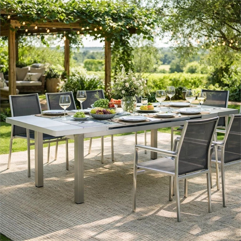 Pemberly Row 90 Inch Extendable Outdoor Dining Table with Polyresin Top in Gray