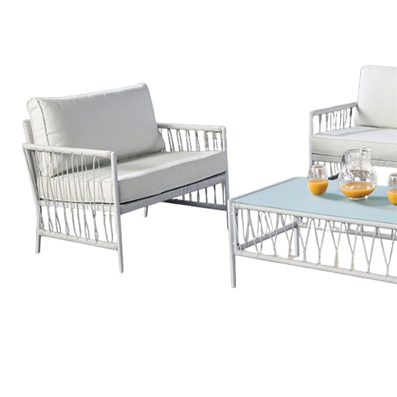 Pemberly Row 4 Piece Outdoor Patio Set with Wicker Sofa and Glass Table in White