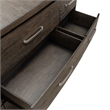Pemberly Row 9 Drawer Dresser with Starburst Veneer and Bow Shaping in Brown