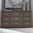 Pemberly Row 9 Drawer Dresser with Starburst Veneer and Bow Shaping in Brown