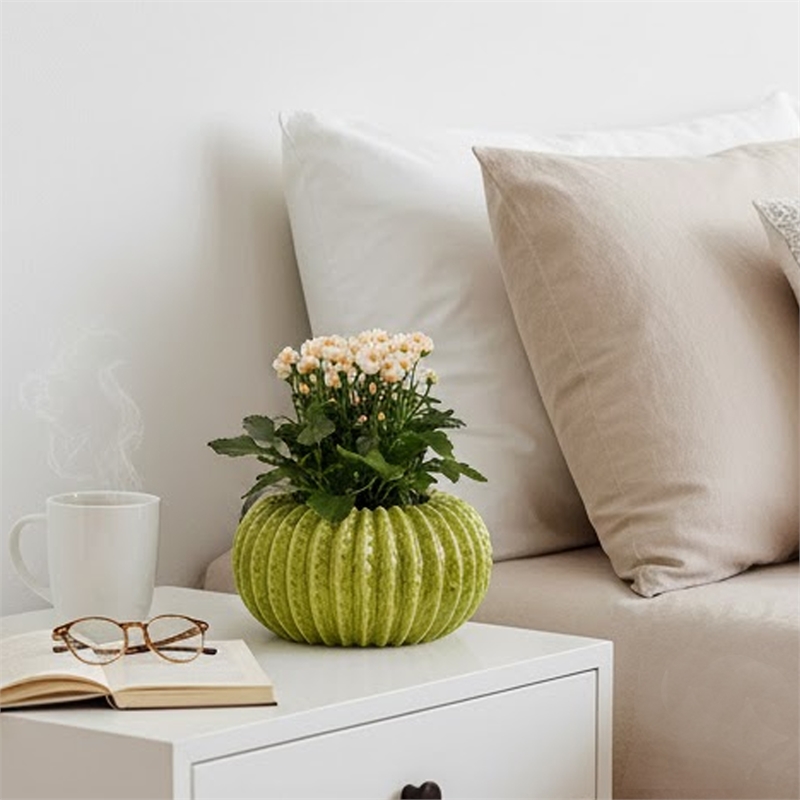 Pemberly Row Melon Shape Decorative Planter in Ribbed Green Ceramic