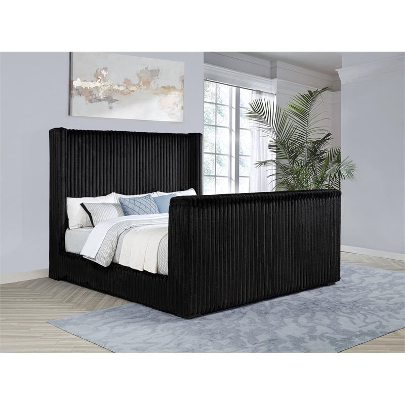 Pemberly Row Upholstered Velvet Eastern King Wingback TV Bed in Black