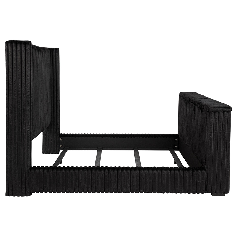Pemberly Row Upholstered Velvet Eastern King Wingback TV Bed in Black