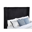 Pemberly Row Upholstered Velvet Eastern King Wingback TV Bed in Black