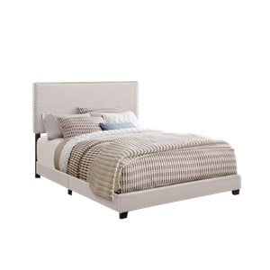 Pemberly Row Nailhead Upholstered Twin Panel Bed in Ivory Finish