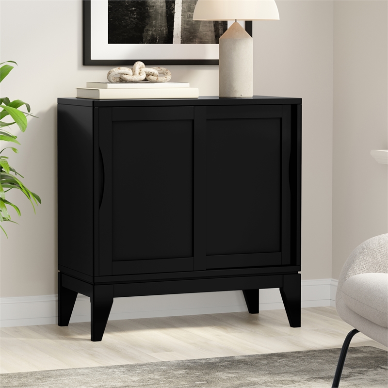 pemberly row mid-century modern low cabinet with sliding doors in black