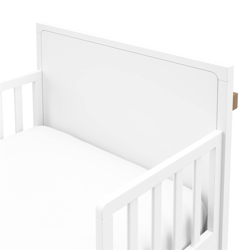 Stork Craft USA Equinox Wood Toddler Bed with Guardrails in White/Driftwood