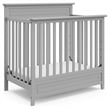 Stork Craft USA Petal 4-in-1 Engineered Wood Convertible Mini Crib in Gray