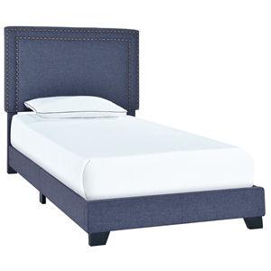 denim blue upholstered twin bed with double nail head trim